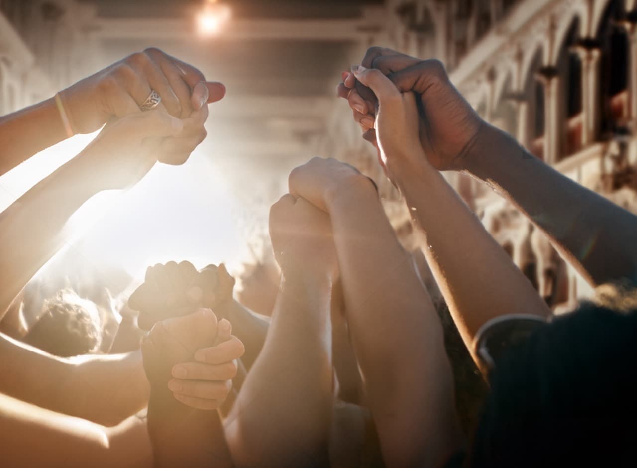 Bunch of people holding hands