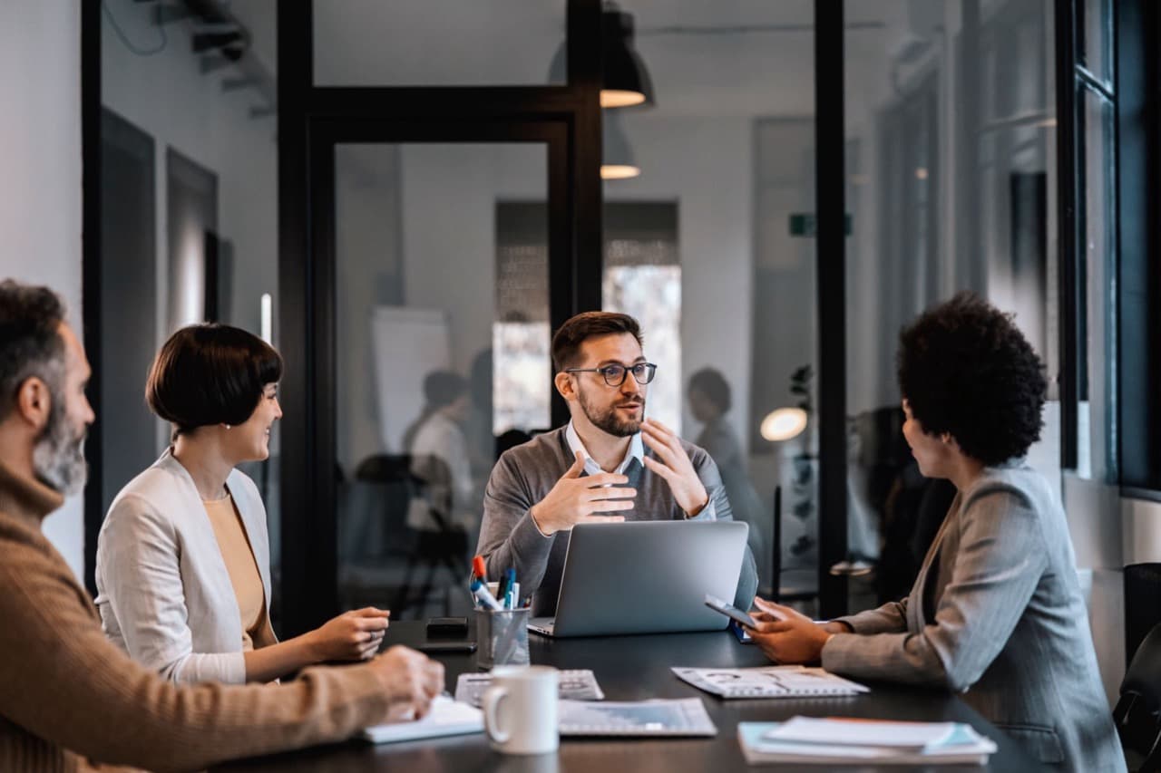 group of people having discussion in meeting room