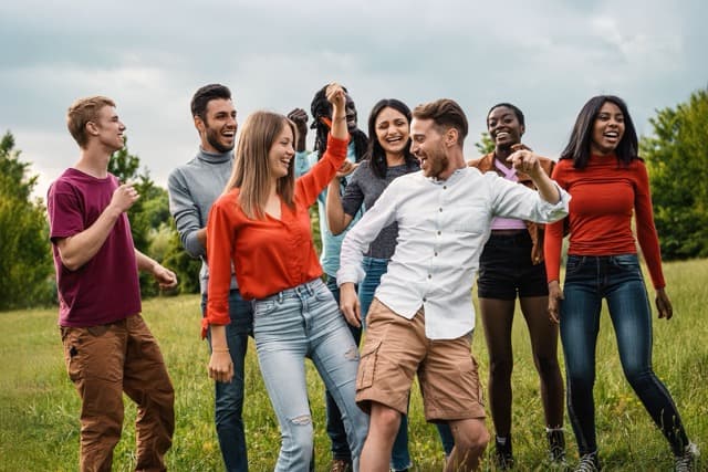 group of people happily dancing