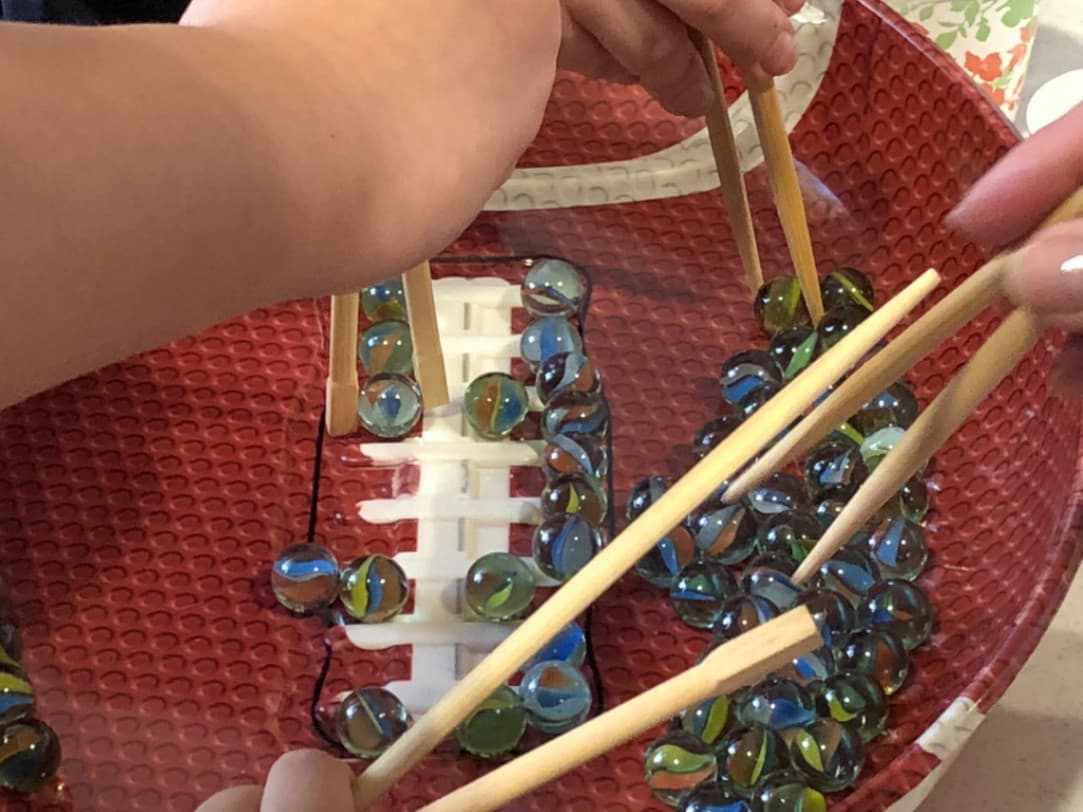 15 Chinese New Year Office Party Ideas: Chopstick Challenge